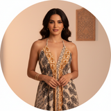 Circular portrait of Yara El-Sayed, a well-traveled woman, wearing the deep V-neck Aureyra Maxi Dress, with a warm, elegant b